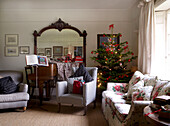 Living room with christmas tree and large mirror