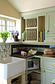 Country kitchen set below eaves in pastel green