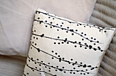 Floral patterned black and white print cushion