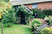 19th century Suffolk farm workers cottage garden exterior