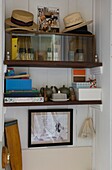 Boat oar and various items on shelf