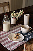 Table set and cookies on plate mat