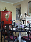 Oriental style dinning room with table setting