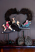 Wooden carved Christmas decorations and heart shaped wreath