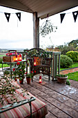 Lit candles o wooden deck of Hereford country home