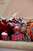 Christmas decorations and gift boxes with cushions