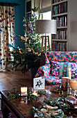 Christmas tree and table with lit candles and greenery Hereford country home