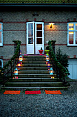 Lanterns lit on steps of converted school building in Odense Denmark
