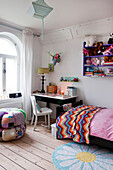Child's bedroom with soft toys on wall mounted shelving