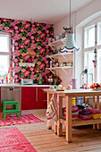 Pink floral wallpaper and workbenches in Odense kitchen
