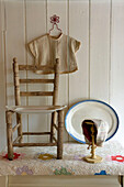Wood chair and serving plates with clothing and bonnet Devon