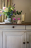 Living room sideboard with flower display and candle