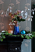 Christma flower arrangement on mantlepiece of London home UK