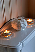 Detail of lit candles in a bathroom