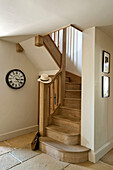 Clock face at wooden staircase in Canterbury home England UK