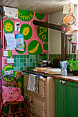 Range oven in pink and green kitchen detail UK