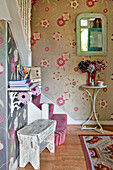 Contemporary floral wallpaper in hallway staircase of London home England UK