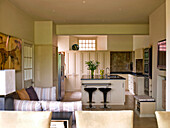 Open plan kitchen and sitting area in rural Suffolk home England UK