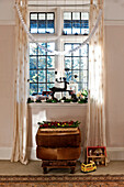 Christmas decorations in sunlit window of family home, Forest Row, Sussex, England, UK