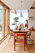Vintage table and chairs in contemporary Hertfordshire family home, England, UK