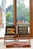 Retro fabrics on vintage chairs in Hertfordshire family home, England, UK