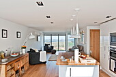 Open plan kitchen and living room in contemporary Wadebridge home, Cornwall, England, UK