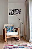 cWooden rocking chair at window with photographs n contemporary home, Cornwall, England, UK