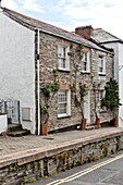Stone and whitewashed cottages in coastal village of Padstow, Cornwall, England, UK