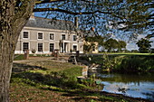 Detached Suffolk country house and lake, England, UK