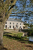 Detached Suffolk country house and lake, England, UK