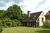 Lawned garden exterior of Essex/Suffolk home, England, UK