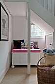 Under stairs seating and storage in contemporary Suffolk/Essex family home, England, UK