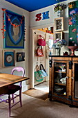 Bags and artwork displayed in London home, England, UK