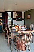 Wooden dining table and chairs in Shropshire cottage, England, UK