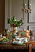 Teacups on table with mince pies and Christmas decorations in Tregaron home Wales UK