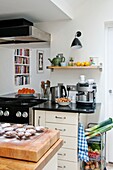 Biscuits on cooling tray with vegetable rack in kitchen of Penzance family home Cornwall England UK
