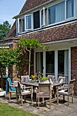 Patio furniture on terrace of detached East Grinstead house Sussex England UK