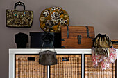 Vintage handbags with wicker storage baskets in East Grinstead family home West Sussex England UK