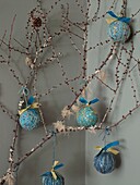 Handmade Christmas baubles hang on branch in London home England UK
