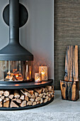 Modern fireplace with firewood in Lechlade living room Gloucestershire England UK
