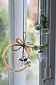 Natural twine and raffia turn plain glass baubles into simple rustic decorations for the house