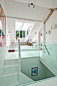 Window seat in spacious attic conversion of family townhouse Cornwall England UK