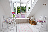 Window seat in attic conversion of family townhouse Cornwall England UK