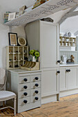 Light grey kitchen cupboards and drawers in Marazion beach house Cornwall UK