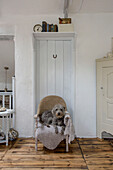 Pet dog on small chair in Marazion beach house Cornwall UK