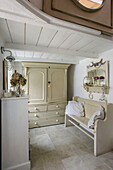 Cream bench seat and wardrobe in Marazion beach house Cornwall UK