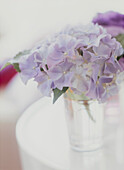 Purple hydrangeas in a glass vase