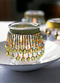 Glass candle holders with applied ribbon and glass bead decoration