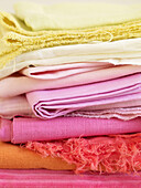 Assorted fabrics in yellows and pinks