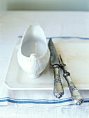 Antique silver knife and fork with gravyboat